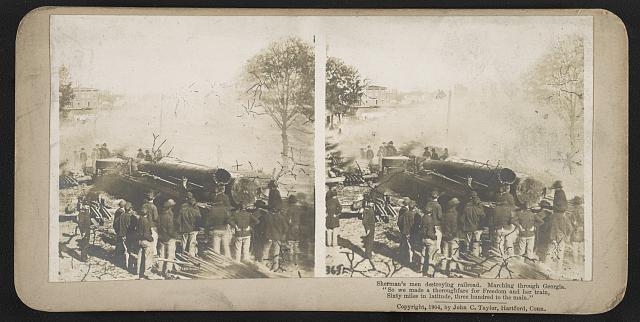 Sherman's men destroying railroad. Marching through...