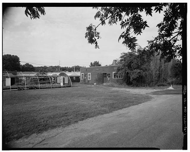 VIEW NORTHEAST, WEST FRONT OF PACKING SHED (BUILDING 20)...