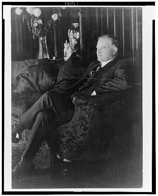 [Herbert Hoover, full-length portrait, seated on sofa,...