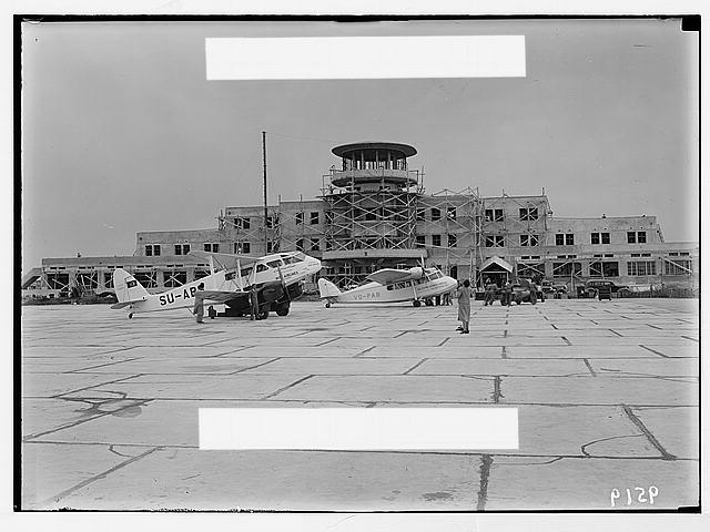 Lydda Airport. Airport building showing a Misr plane &...