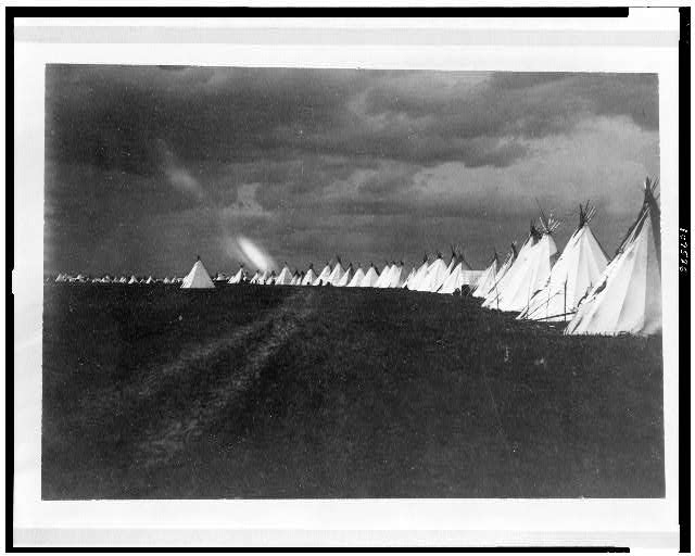 [Sioux (?) tepees in a line, North or South Dakota (?),...