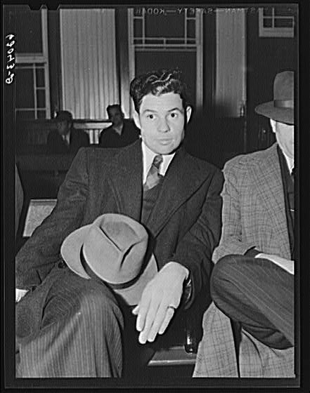 Man waiting in railroad station. Radford, Virginia