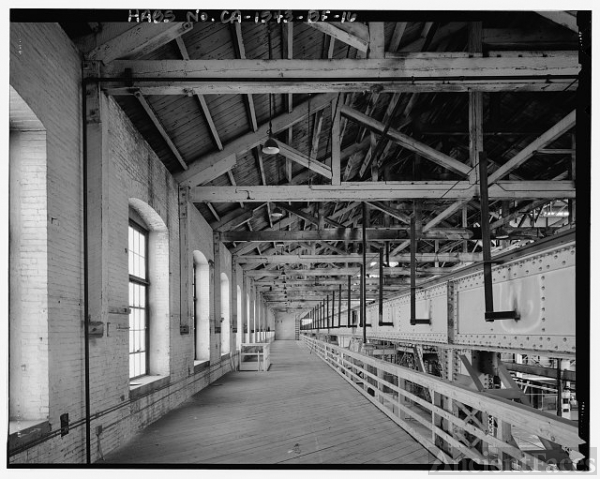 Interior view of second floor walkway along west wall;...