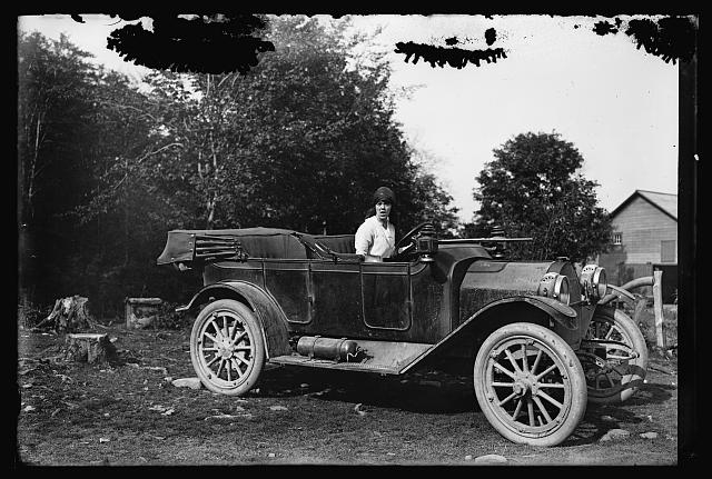 Woman in automobile, c.1915