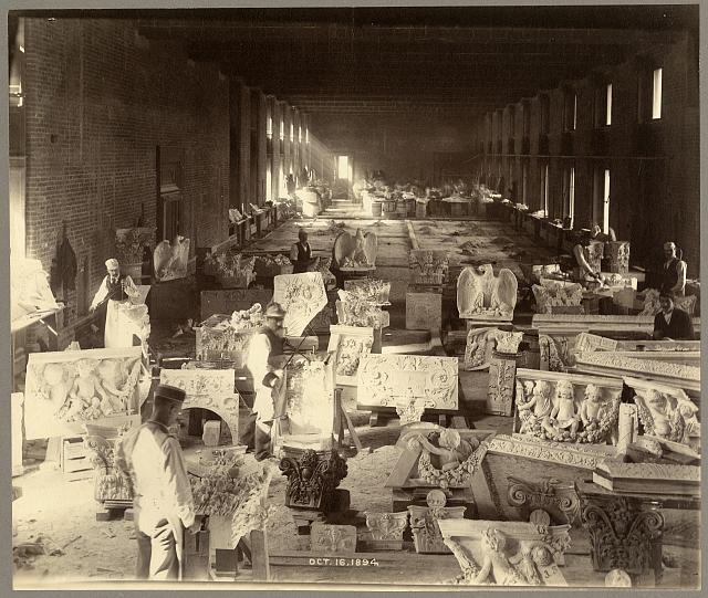 [Men carving sculpture for the Library of Congress Thomas...