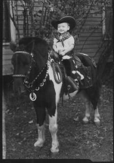 Child on photographer's pony