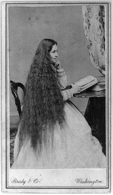 [Mrs. Gen. M. Vickers(?) with long flowing hair,...