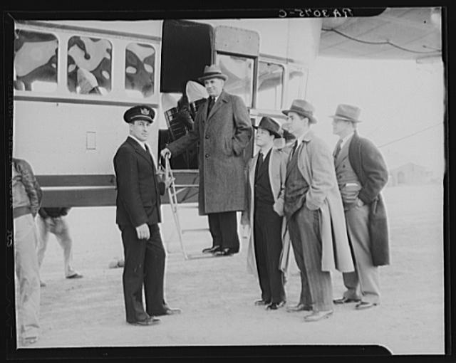 Administrator Tugwell with captain of ship, two of his...