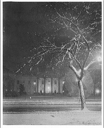 White House exteriors. Front view of White House at night...