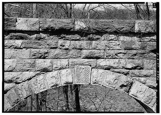 5. TOP OF ARCH AND VIADUCT. NOTE THAT STONES OF ARCH HAVE...