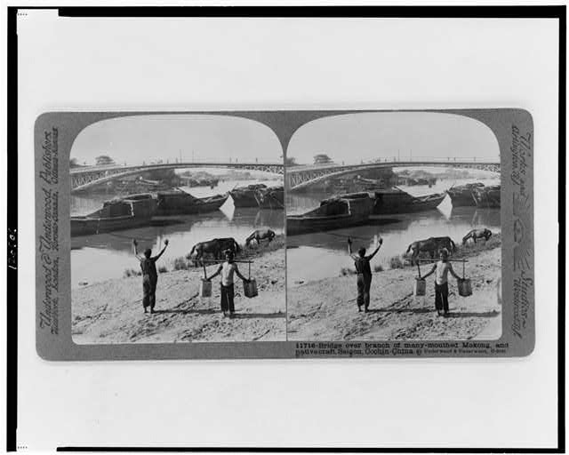 Bridge over branch of many-mouthed Mekong, and native...