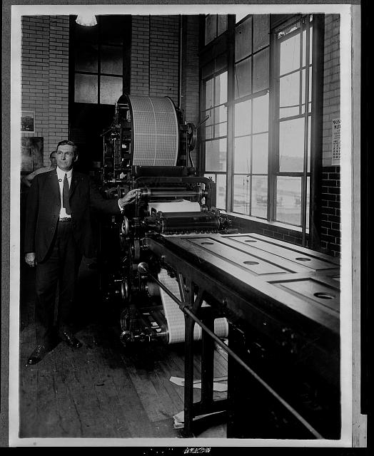 [Benjamin R. Stickney standing next to a postage stamp...