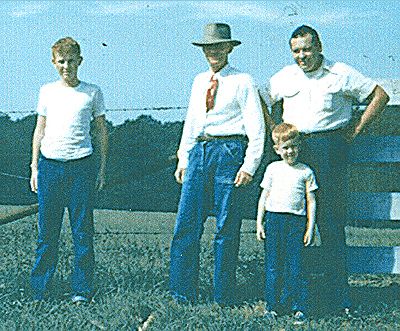 Lawrence Mills with son, son-in-law and grandson