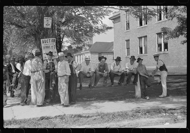 Farmers hanging around courthouse on court day during...
