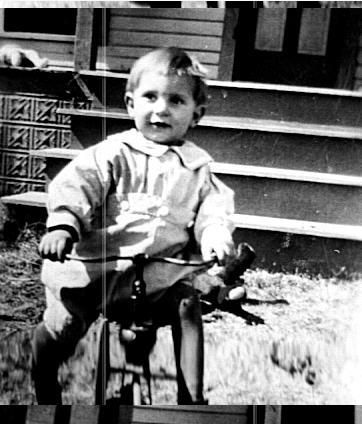 small boy on tricycle