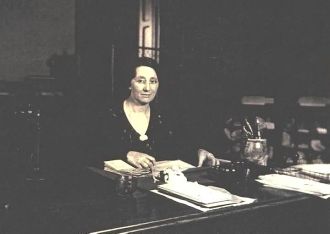 Verna Rogers Henry, at her desk