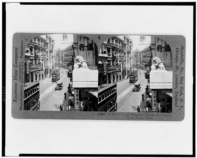 A street in the shopping district of Victoria, Hong Kong,...