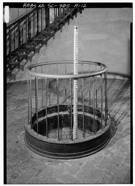 12. LAMP MECHANISM WEIGHT PIT, WITH SCALE, LOOKING...