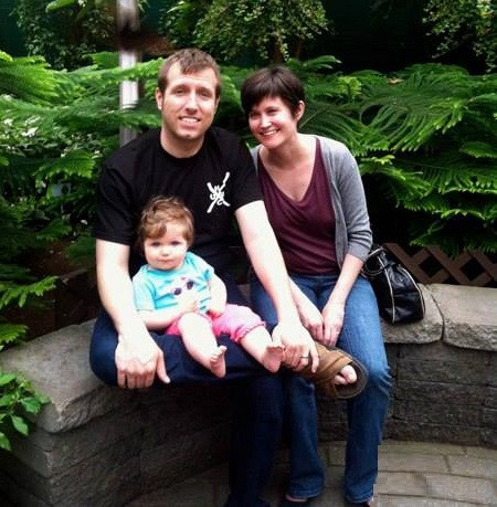 Thom Belote with wife and child.