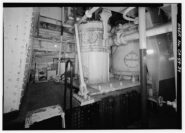 34. Engine room, view of vacuum pump with condenser to...