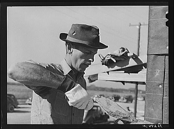 White bricklayer, Corpus Christi, Texas. He is working on...