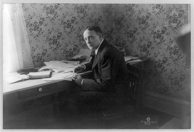 [Billy Sunday, full-length portrait, seated at desk,...