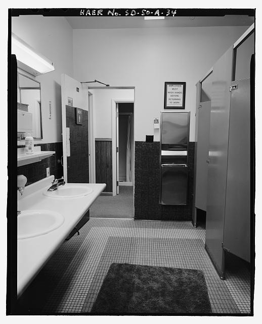 34. Men's latrine, looking north - Ellsworth Air Force...