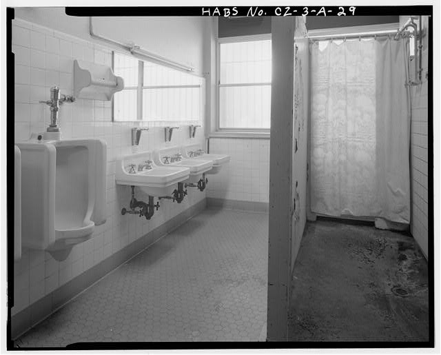 Interior view of first floor men's restroom, facing...