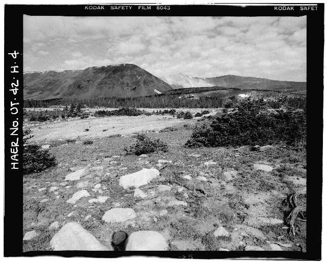 4. VIEW OF DOWNSTREAM FACE OF DAM, WITH SCARS FROM EARTH...
