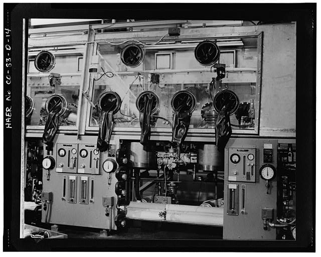 14. VIEW OF THE OUTSIDE OF A GLOVE BOX THAT CONTAINS...