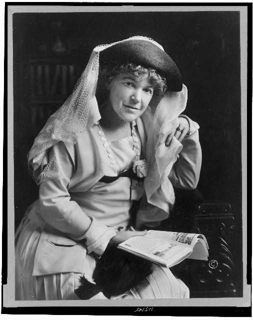 [Ella Wheeler Wilcox, seated, three-quarter length...