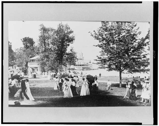 [People socializing at Chautauqua, New York, with Lake...