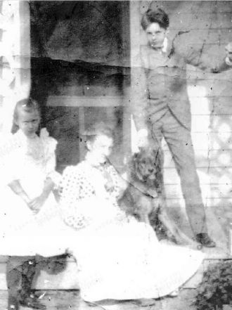Blow up of Emma Halkett on porch - unknown kids