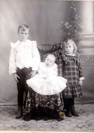 Boy Girl Baby in Chair