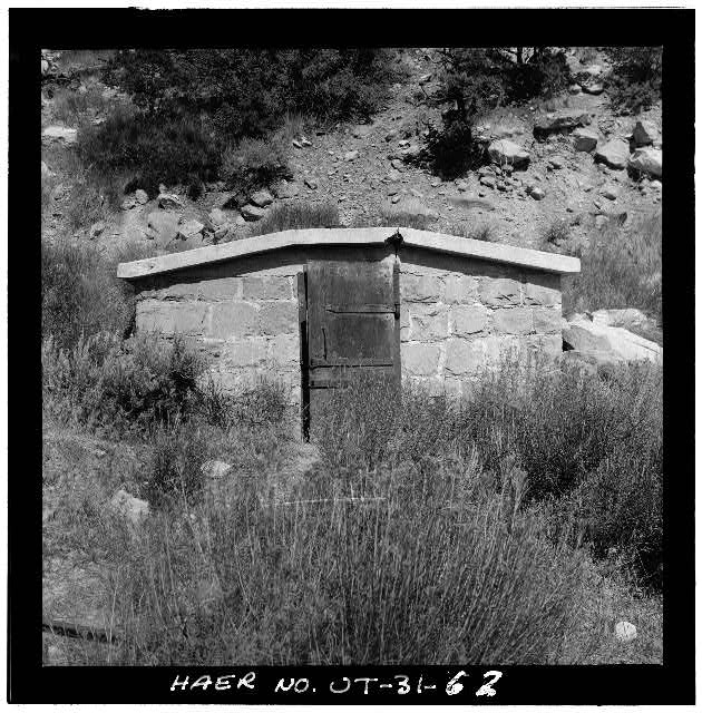 62. VIEW OF THE WEST ELEVATION OF THE DYNAMITE STORAGE...