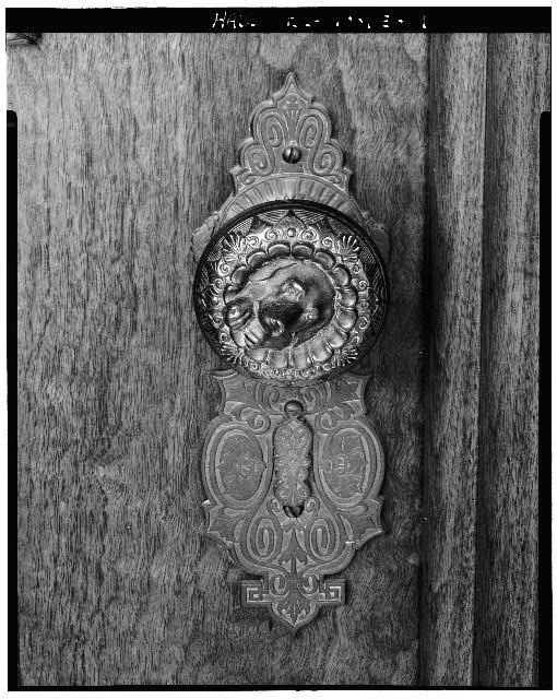 9. Detail view of original doorknob, main entrance double...