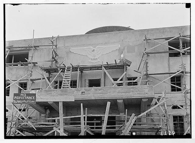 Lydda Airport. Sculptured flying-eagle on building...