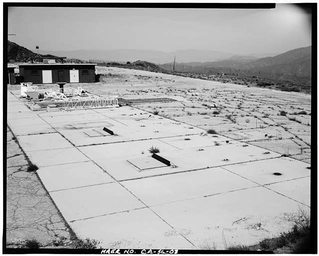 8. VIEW SHOWING STORAGE BUILDING ACROSS FROM LAUNCH PAD,...