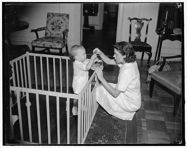 Amusing baby with toys