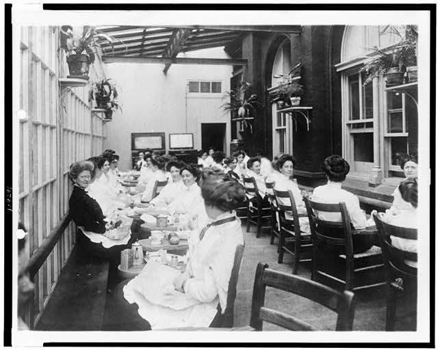 [Women eating in a lounge at the Treasury Department,...