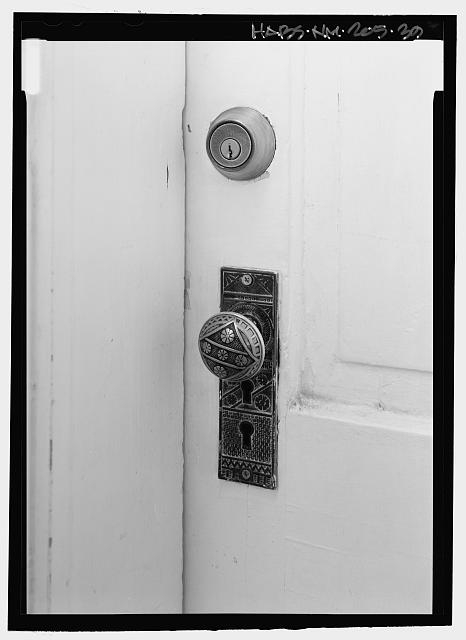 Detail view of doorknob and plate, at north exterior door...