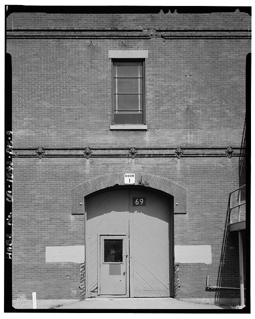 Detail of arched door and window on east elevation;...