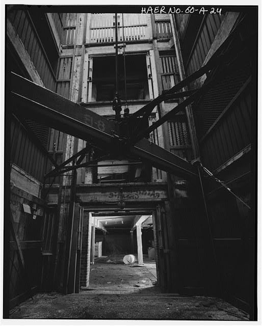 24. VIEW FIRST FLOOR ELEVATOR PLATFORM, LOOKING DOWN THE...