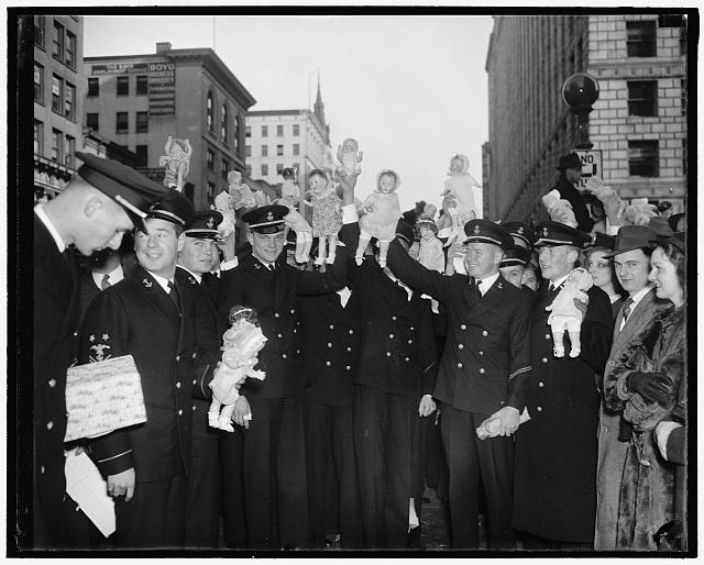 Midshipmen donate dolls for poor kiddies of Capitol....