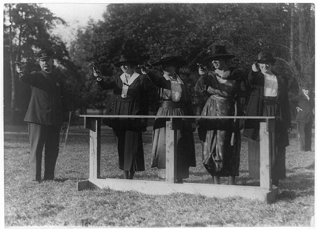 Training a policewoman--target practice under the...