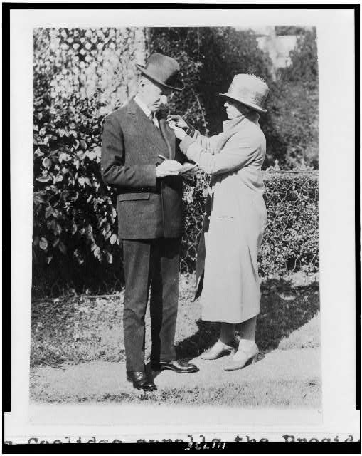 Mrs. Calvin Coolidge enrolls the President in the...