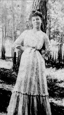Girl Leaning against Tree