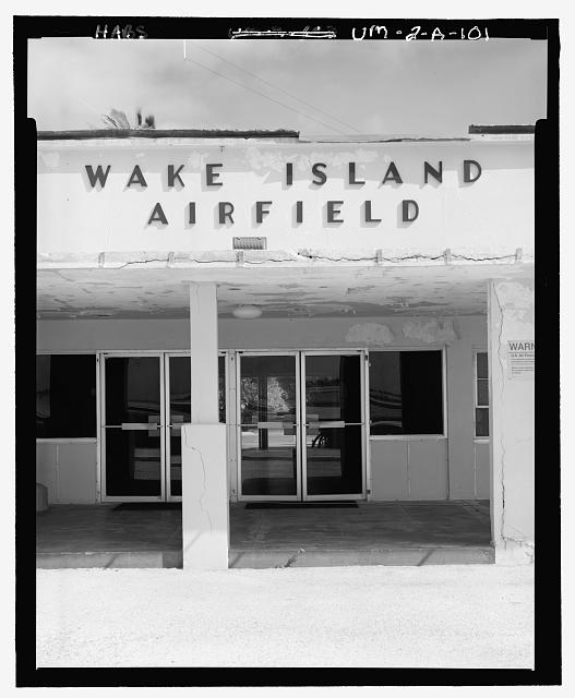 SIGN ON WEST SIDE OF BUILDING ABOVE LANAI ("WAKE ISLAND...