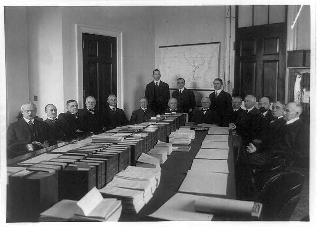 [Committee on Rivers and Harbors, 16 men around table]