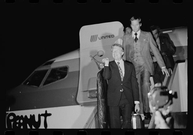 [Jimmy Carter disembarking from the airplane "Peanut One"...
